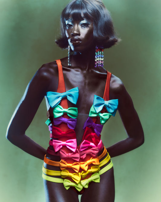 Rainbow colored bow bodysuit